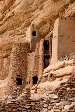 This photo depicts a slice of a Dogon Village situated along the sandstone cliffs near Bandiagara, West Mali, Africa.  Photo by Cecile Geng of Le Havre, France. 